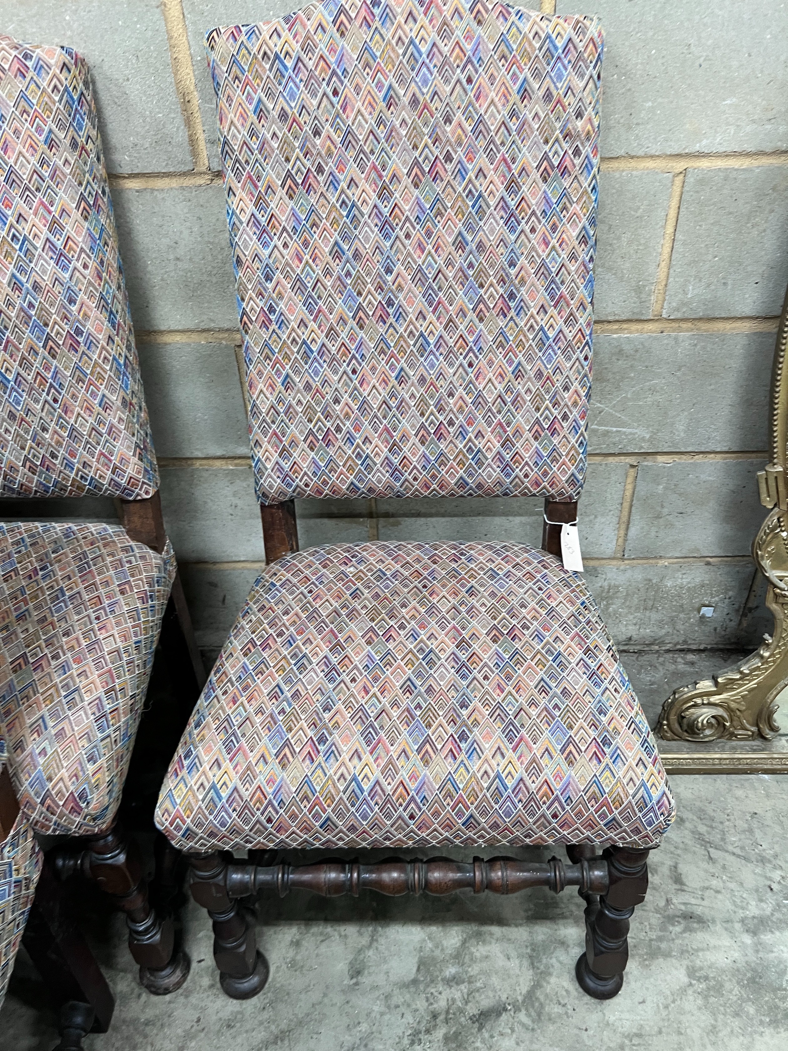 A set of four 17th century style Spanish walnut dining chairs, with upholstered backs and seats *Please note the sale commences at 9am.